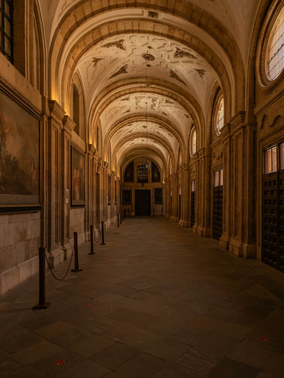 Grand archive library hall with arched ceiling and shelves