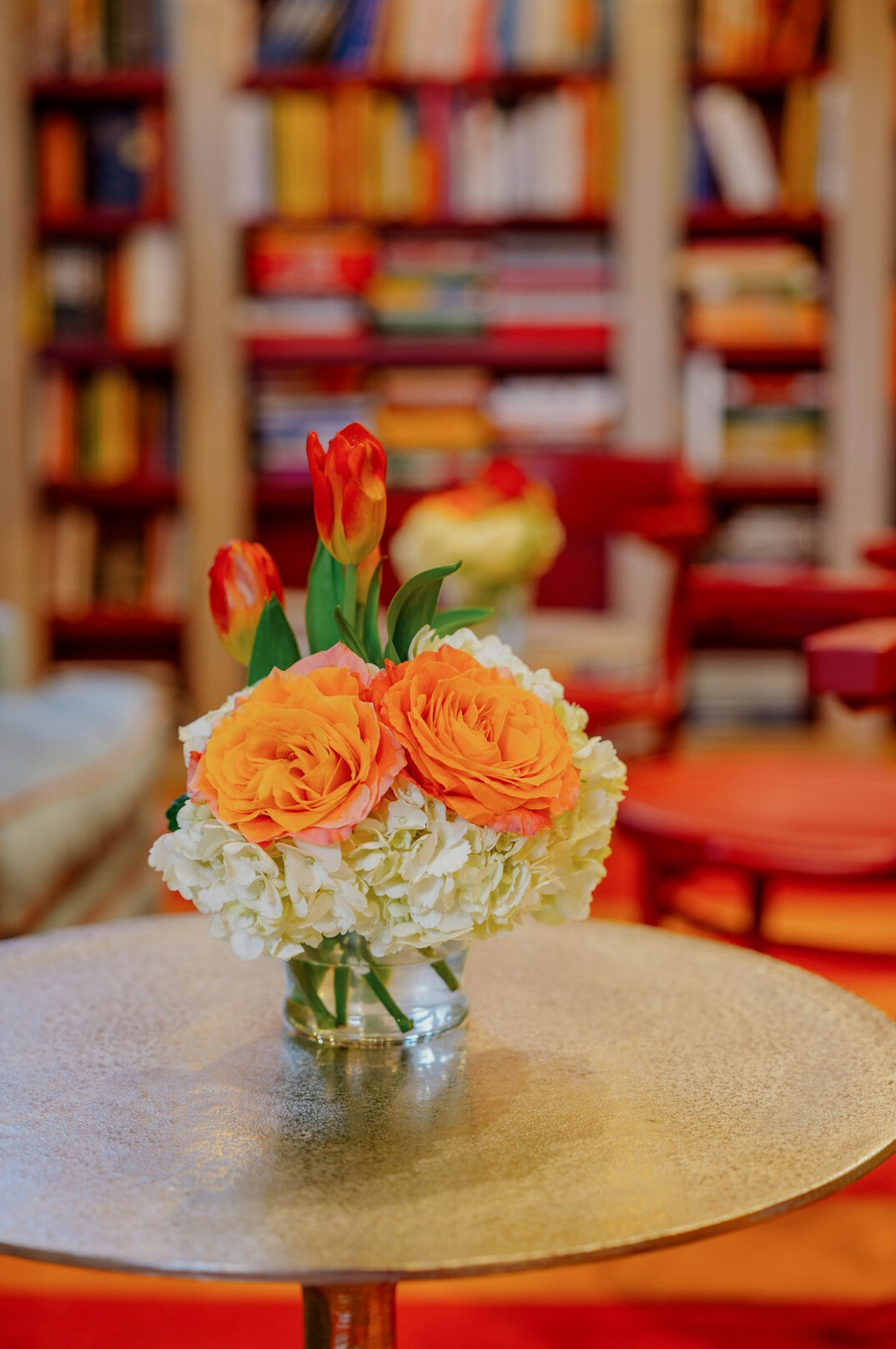 Open books and a lamp on a library table