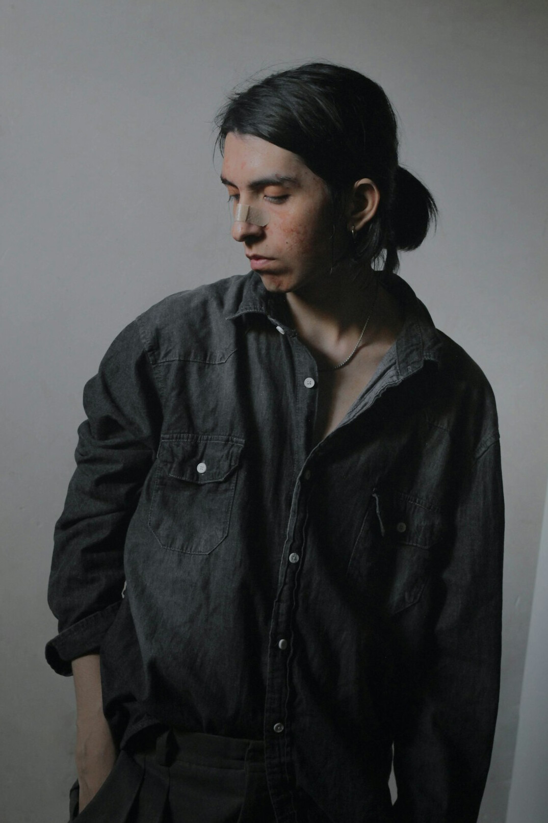 Portrait of a man with dark hair in a shirt
