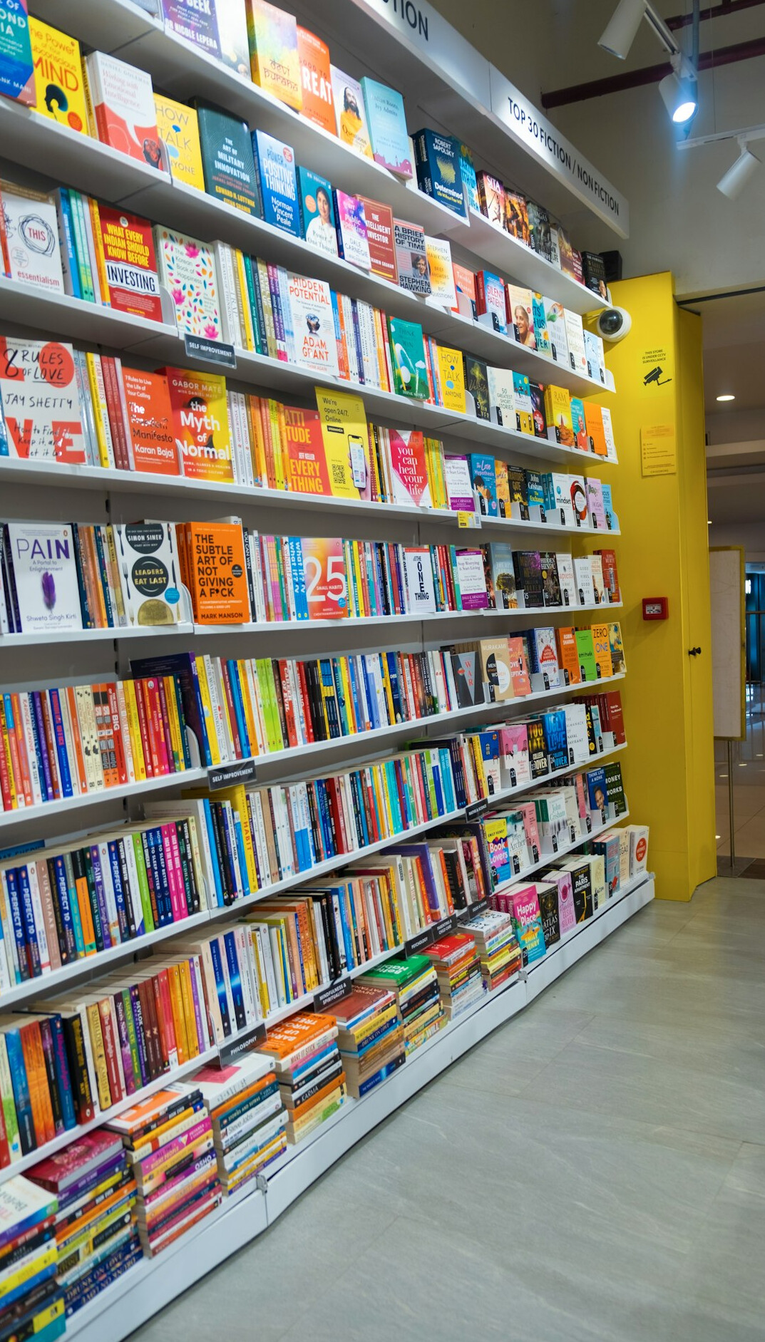 Rows of books on shelves in a bookstore