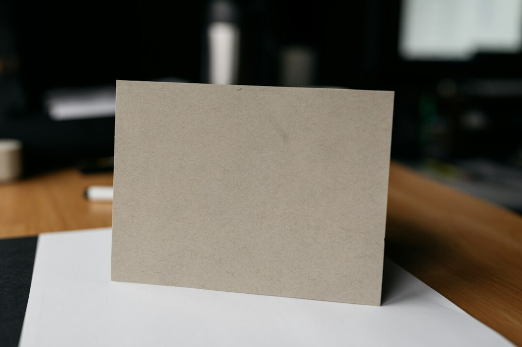 Hand writing on historical documents at a desk